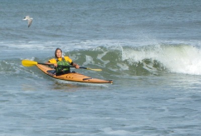 Surfing a Rumour Sea Kayak, Denmark, photo by Nigel Foster