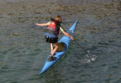 Standing on a Silhouette sea kayak, Kristin Nelson and Nigel Foster