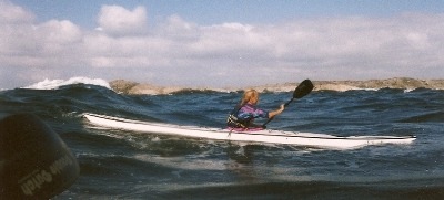 Catching a wave, Silhouette in Sweden, Nigel Foster with seaward Kayaks