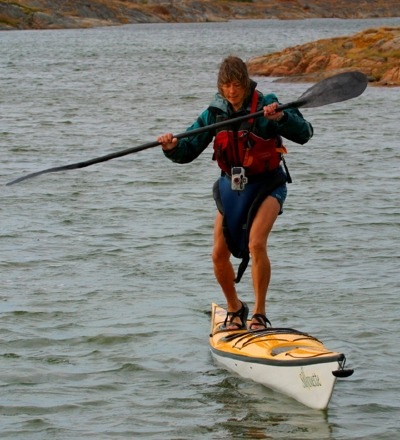 Kristin Nelson stands on deck of Seaward Kayaks Silhouette, by Nigel Foster