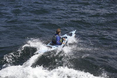 Nigel Foster rides wave past camera in Whisky 16, Sweden Point65